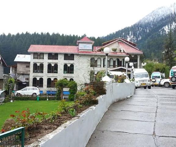 The Orchard Greens Himachal Pradesh Manali hotel view with parking area